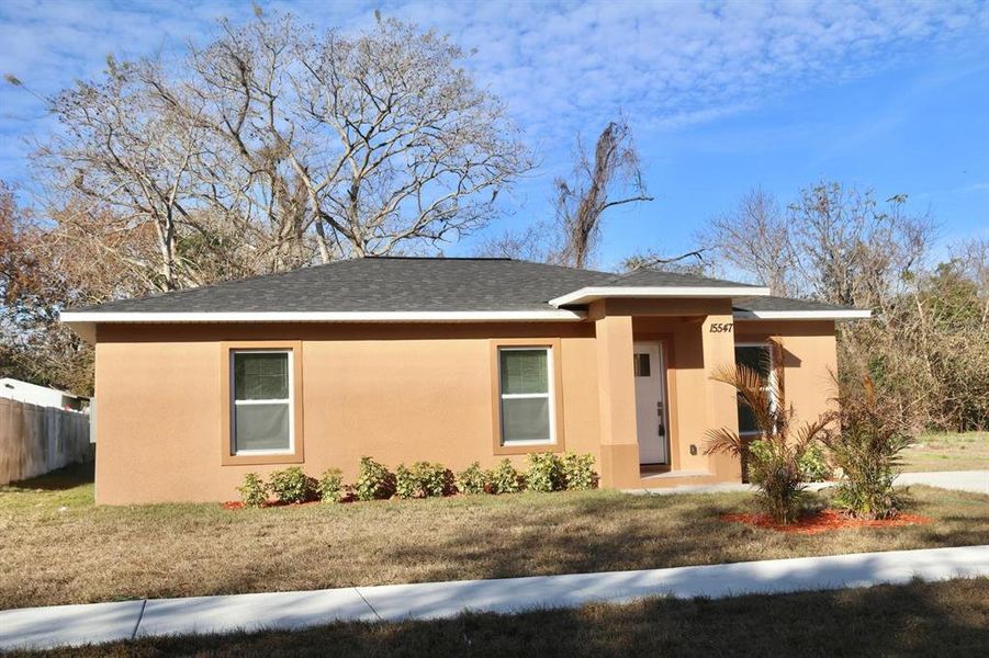 Front exterior of a new home in , Hudson, FL, highlighting curb appeal (Image 27). Front exterior of a new home in , Hudson, FL, highlighting curb appeal (Image 27).