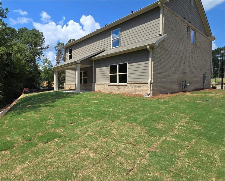 Front exterior of a new home in , Grayson, GA, highlighting curb appeal (Image 2).