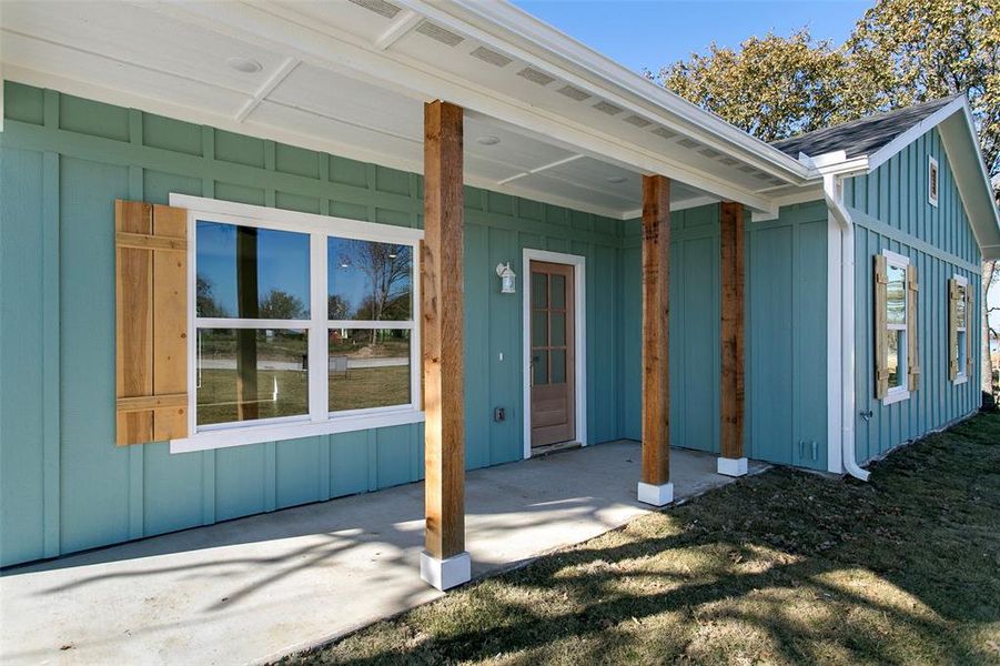 Property entrance with a patio