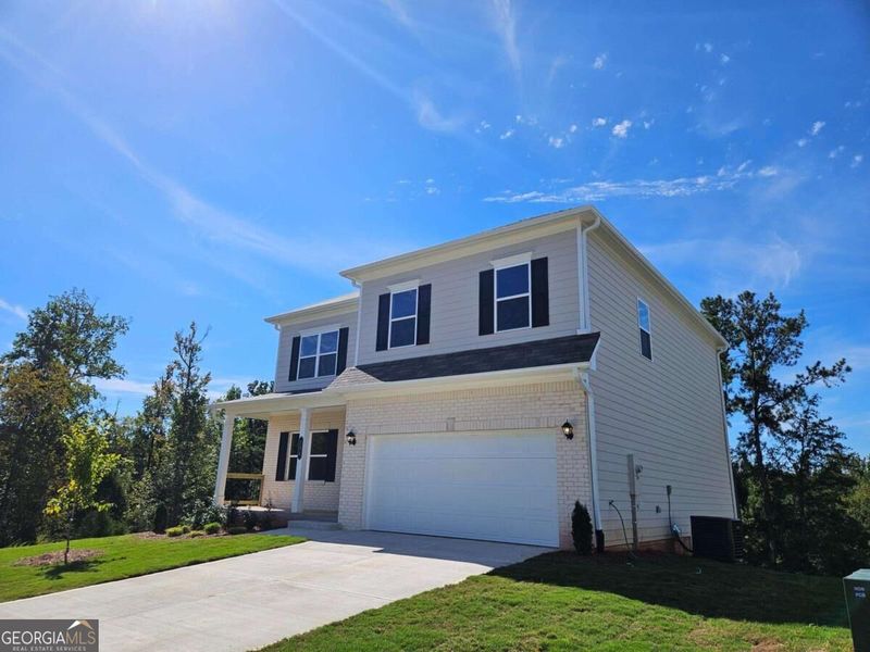 Front exterior of a new home in Maddox Station, Eatonton, GA, highlighting curb appeal (Image 18).