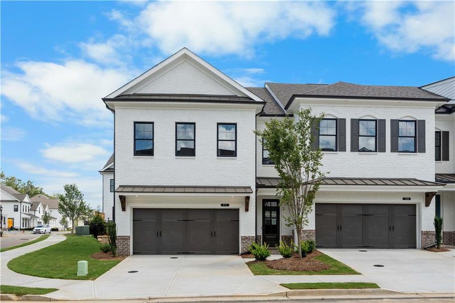 Front exterior of a new home in Millcroft Townhomes, Buford, GA, highlighting curb appeal (Image 25).