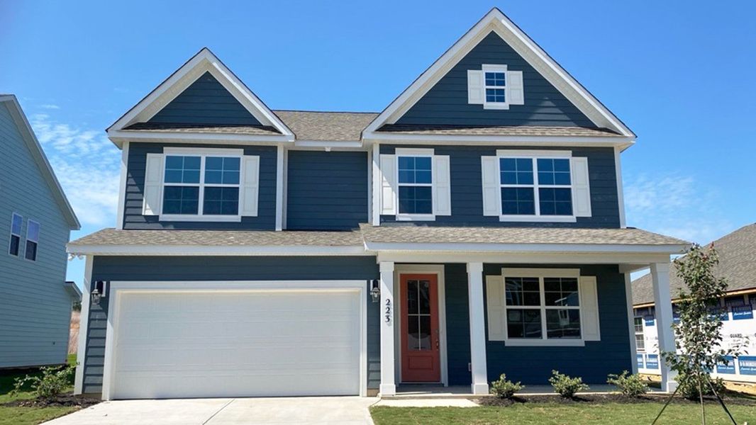 Front exterior of a new home in Livingston Woods, Irmo, SC, highlighting curb appeal (Image 29). Front exterior of a new home in Livingston Woods, Irmo, SC, highlighting curb appeal (Image 29).