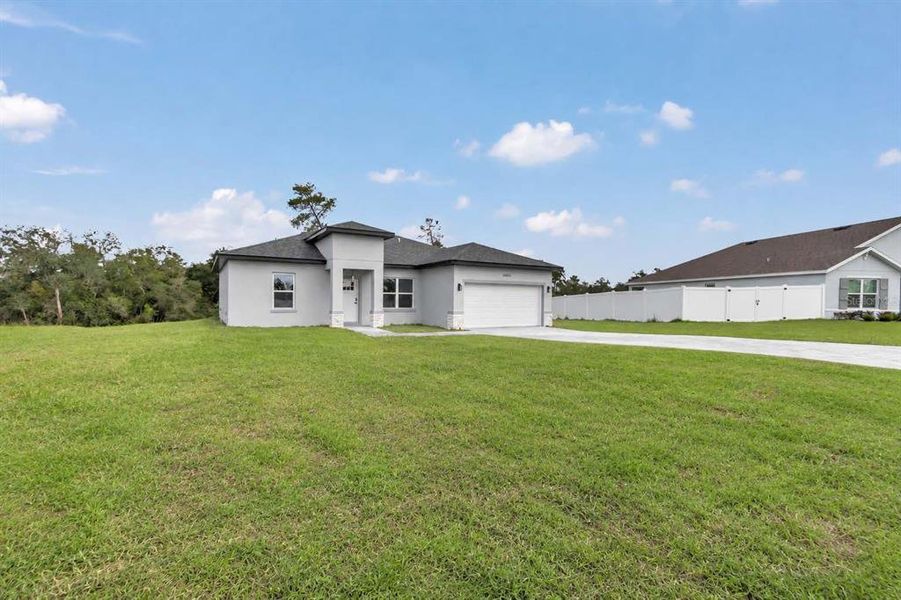 Front exterior of a new home in , Ocala, FL, highlighting curb appeal (Image 19).