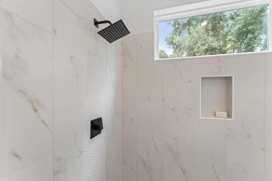 Elegant and serene primary bathroom designed to offer both style and functionality. The space features a luxurious soaking tub ideal for unwinding, a separate glass-enclosed shower for quick refreshes, and a sleek double vanity with ample countertop space and storage—perfect for busy mornings or relaxing evenings. Elegant and serene primary bathroom designed to offer both style and functionality. The space features a luxurious soaking tub ideal for unwinding, a separate glass-enclosed shower for quick refreshes, and a sleek double vanity with ample countertop space and storage—perfect for busy mornings or relaxing evenings.