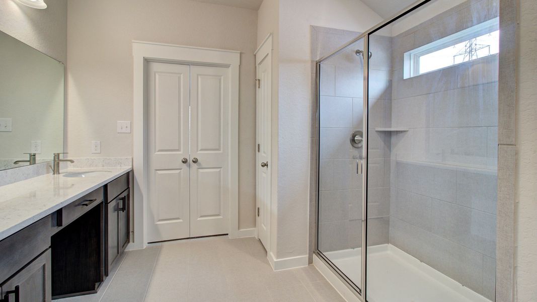 Representative furnished interior of a home built from the Majestic by Brightland Homes in Sunterra, Katy (Image 15).