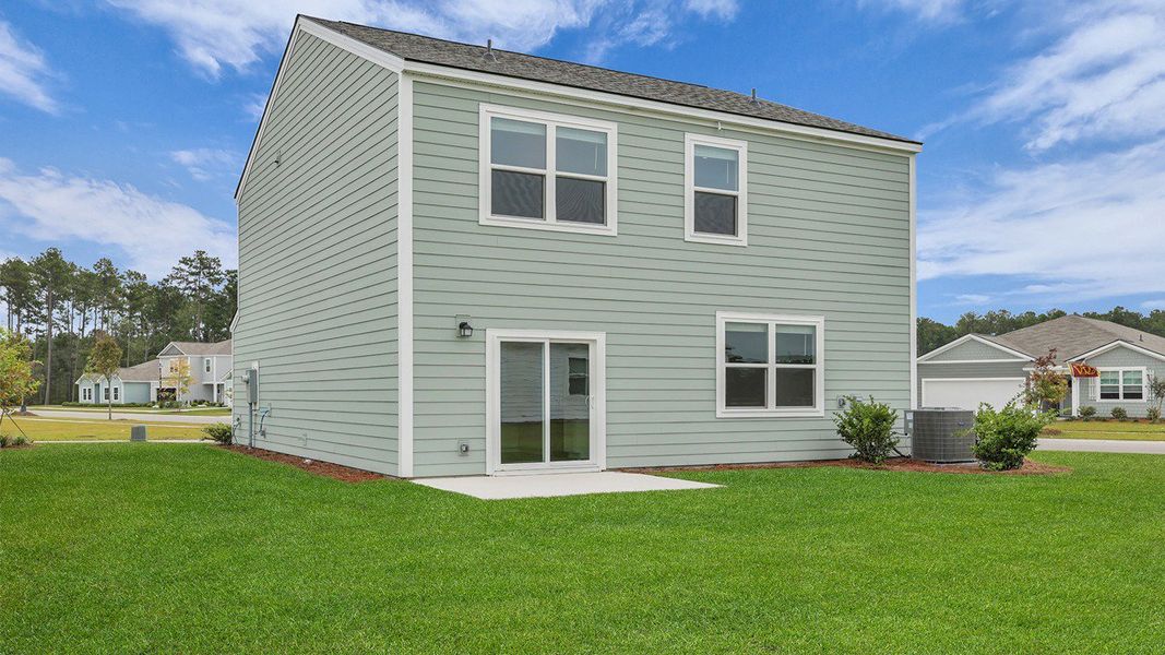 Front exterior of a new home in Hillcrest, Ravenel, SC, highlighting curb appeal (Image 21). Front exterior of a new home in Hillcrest, Ravenel, SC, highlighting curb appeal (Image 21).