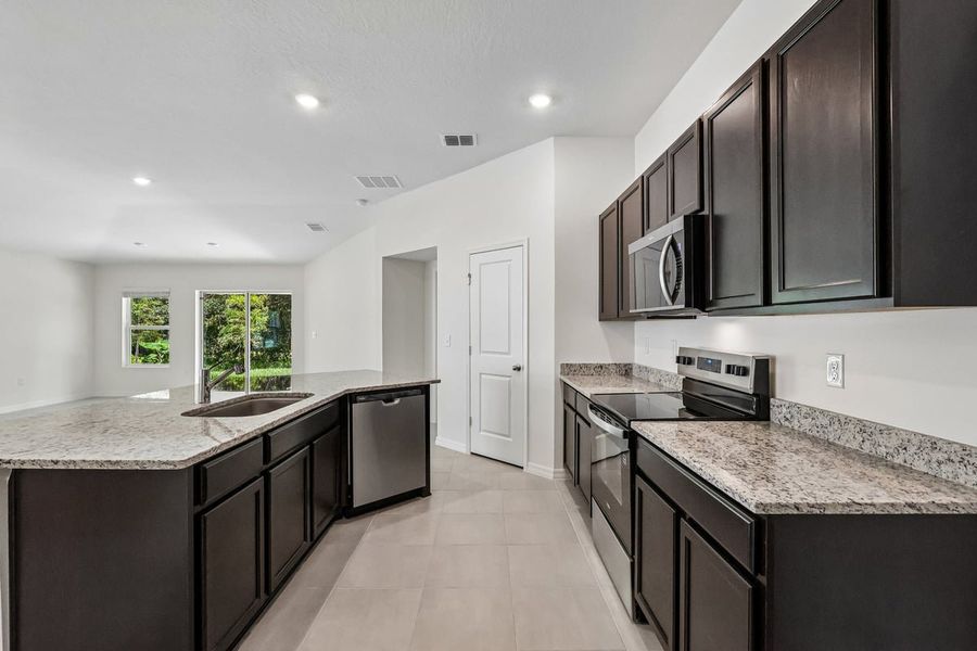 Furnished interior view inside a new home in Hilliard Ridge, Kissimmee (Image 8).