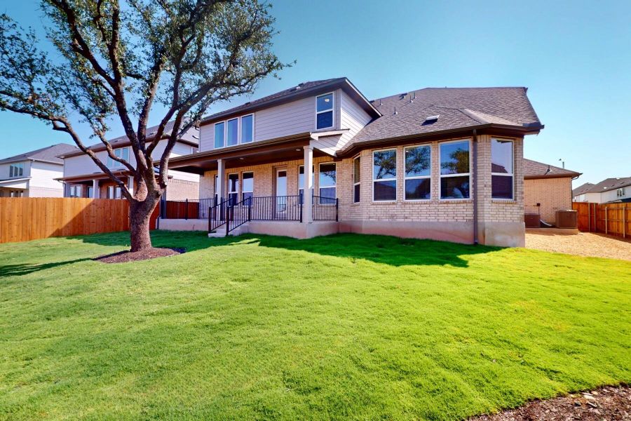 Front exterior of a new home in Edgewood, Leander, TX, highlighting curb appeal (Image 18). Front exterior of a new home in Edgewood, Leander, TX, highlighting curb appeal (Image 18).