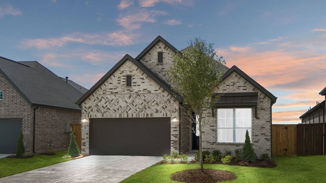 Front exterior of a new home in Brookewater, Rosenberg, TX, highlighting curb appeal (Image 2).