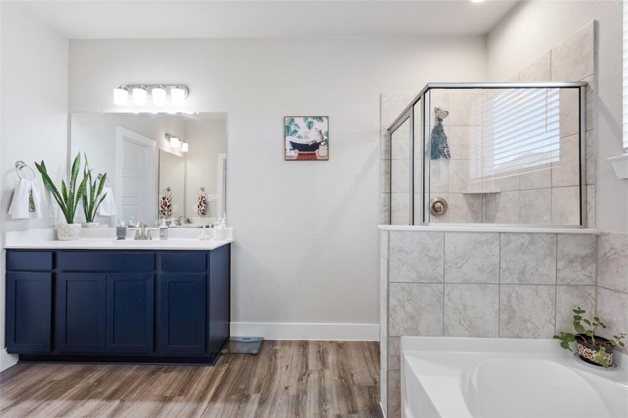 This elegant primary bathroom features a spacious glass-enclosed shower and stylish tile accents, offering a perfect blend of functionality and modern design. This elegant primary bathroom features a spacious glass-enclosed shower and stylish tile accents, offering a perfect blend of functionality and modern design.