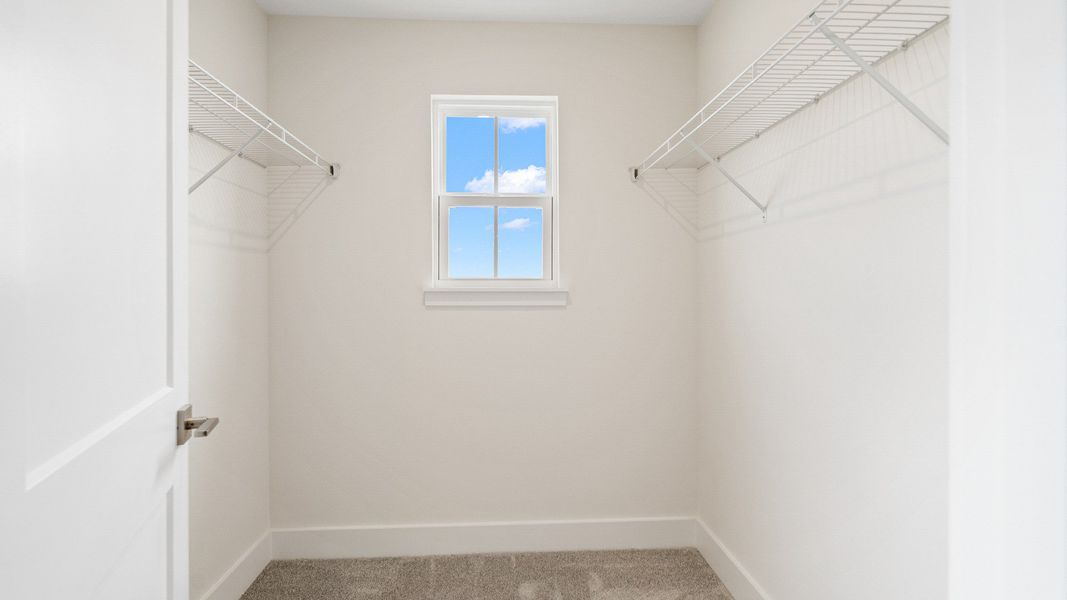 The Sweetgum - Fourth bedroom Walk-in Closet in Trailside in Mount Dora by DRB Homes