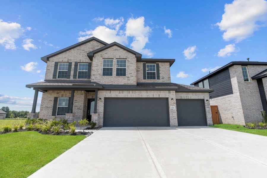 Gorgeous brick front porch elevation with a real 3-car garage, giving the home both curb appeal and exceptional functionality. Gorgeous brick front porch elevation with a real 3-car garage, giving the home both curb appeal and exceptional functionality.
