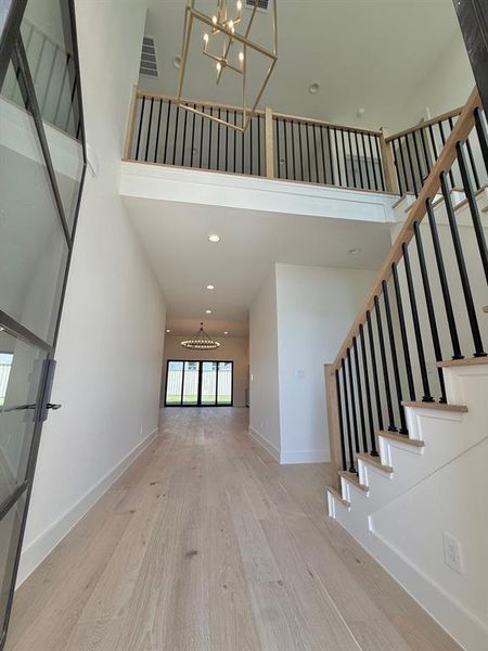 Looking from the entrance towards the loft upstairs and the downstairs living area.