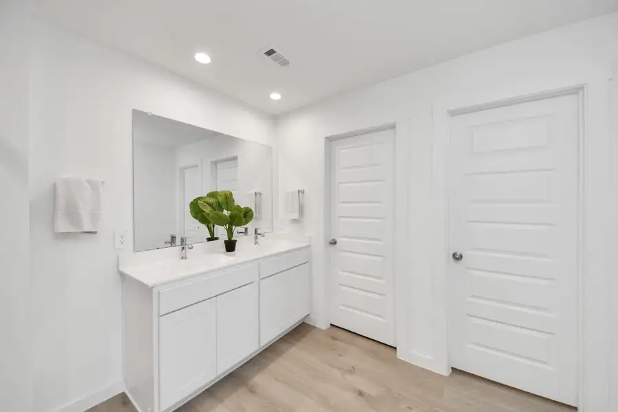 View from shower looking towards LARGE walk-in closet that you must see in person and additionally there is a water closet for ultimate privacy.