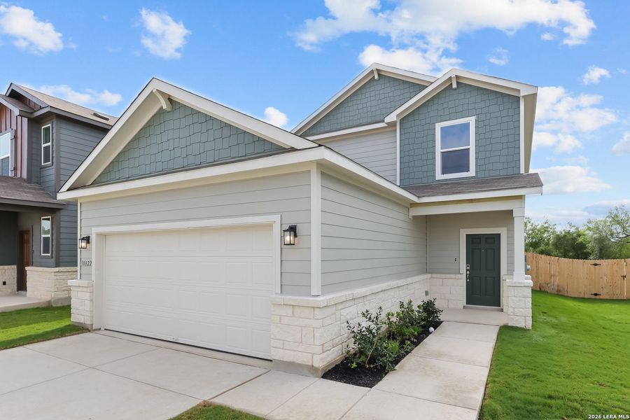 Front exterior of a new home in Applewhite Meadows, San Antonio, TX, highlighting curb appeal (Image 1). Front exterior of a new home in Applewhite Meadows, San Antonio, TX, highlighting curb appeal (Image 1).