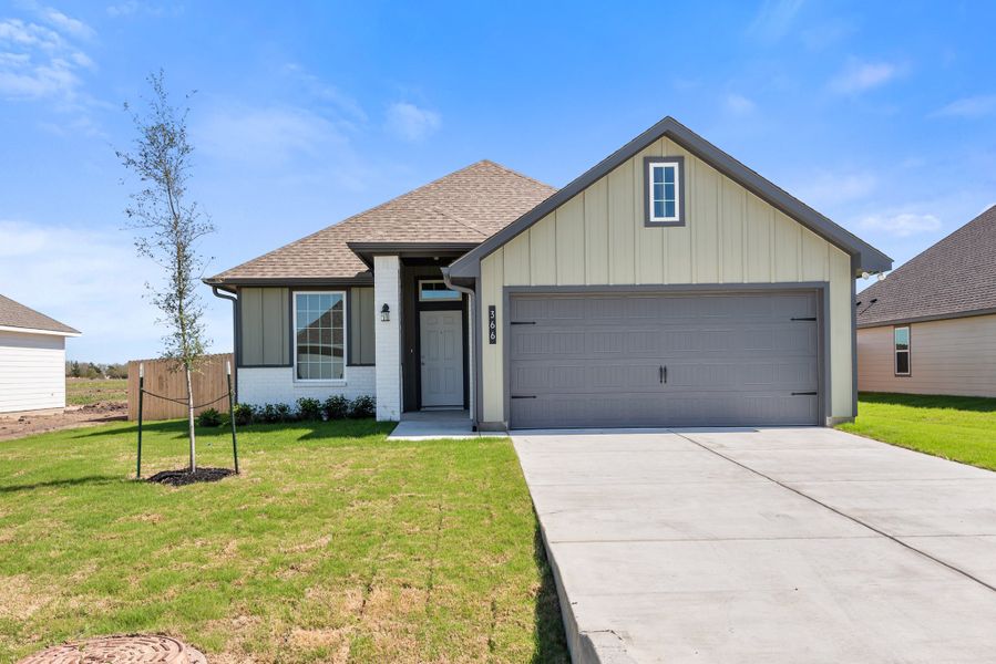 Front exterior of a new home in Grand Lake, Snook, TX, highlighting curb appeal (Image 1). Front exterior of a new home in Grand Lake, Snook, TX, highlighting curb appeal (Image 1).