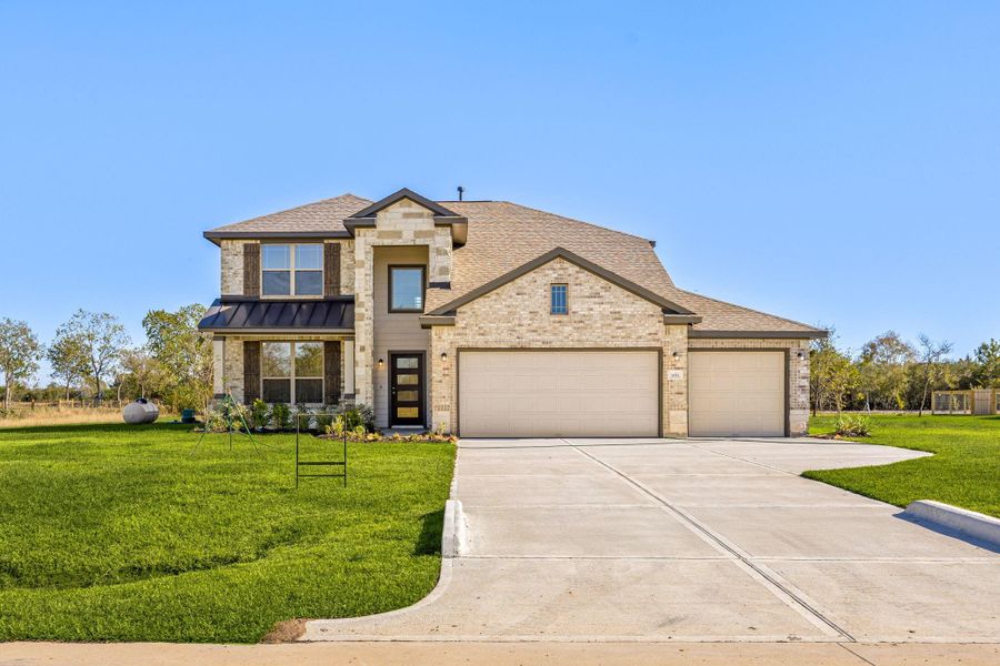 Front exterior of a new home in Southfork Ranch, Sealy, TX, highlighting curb appeal (Image 22).