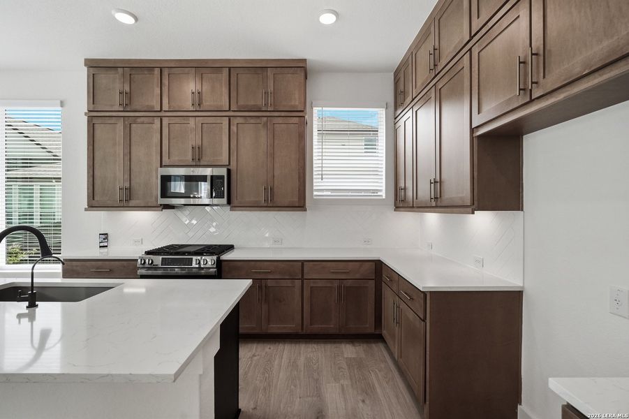 Furnished interior view inside a new home in Centero at Stone Oak, San Antonio (Image 11).