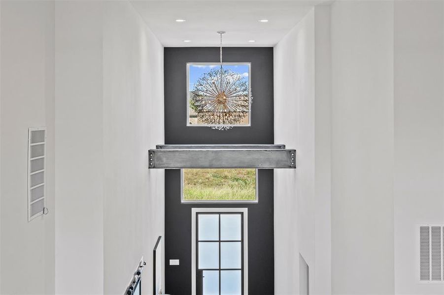 Detailed view of a chandelier and recessed lighting