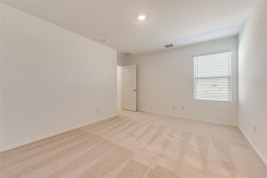 Unfurnished room with light colored carpet