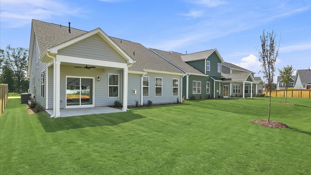 Warm and inviting outdoor living space with a covered rear porch and tasteful finishes Warm and inviting outdoor living space with a covered rear porch and tasteful finishes