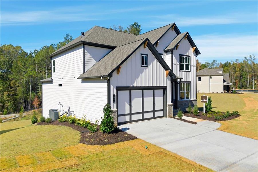 Front exterior of a new home in Sterlington, Canton, GA, highlighting curb appeal (Image 25). Front exterior of a new home in Sterlington, Canton, GA, highlighting curb appeal (Image 25).