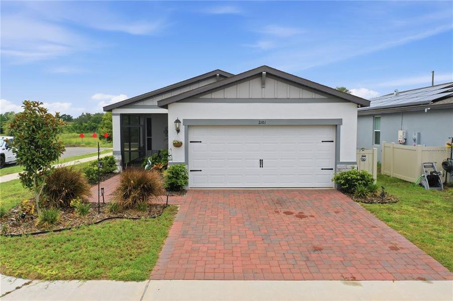 Front exterior of a new home in , Haines City, FL, highlighting curb appeal (Image 24).
