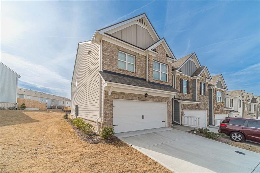 Front exterior of a new home in , Buford, GA, highlighting curb appeal (Image 1). Front exterior of a new home in , Buford, GA, highlighting curb appeal (Image 1).