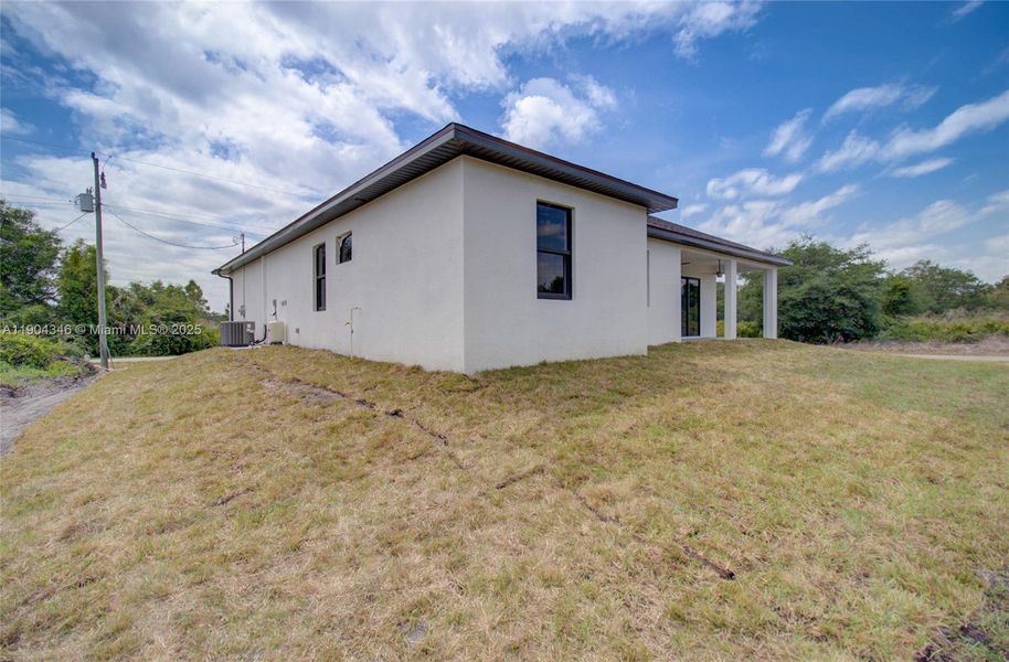 Exterior details and patio area of a home in , Lehigh Acres (Image 21).