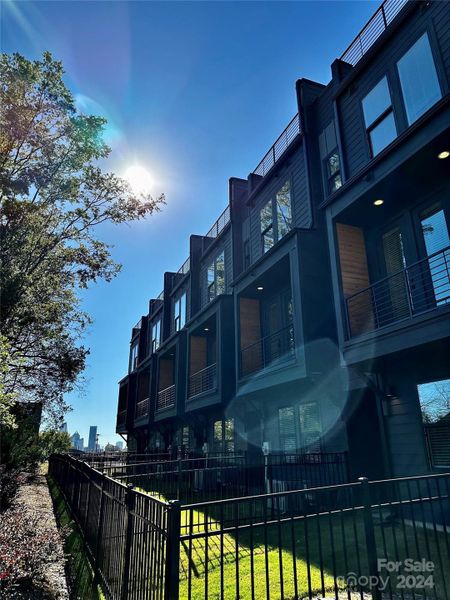 Fenced In Backyard with Uptown Views.