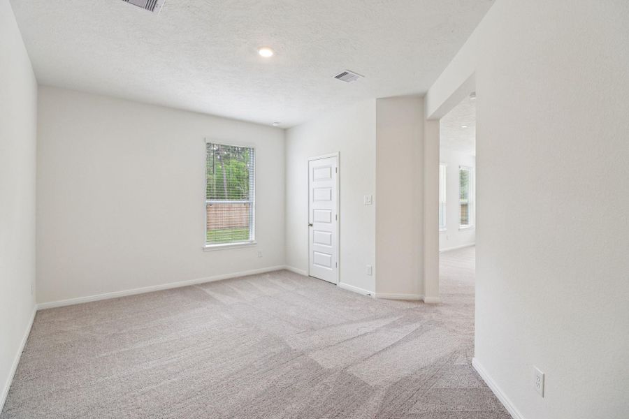 Right off the Great Room is the Den! The Den offers a versatile space that seamlessly expands your living options—perfect for a home office, playroom, media space, or whatever suits your lifestyle.