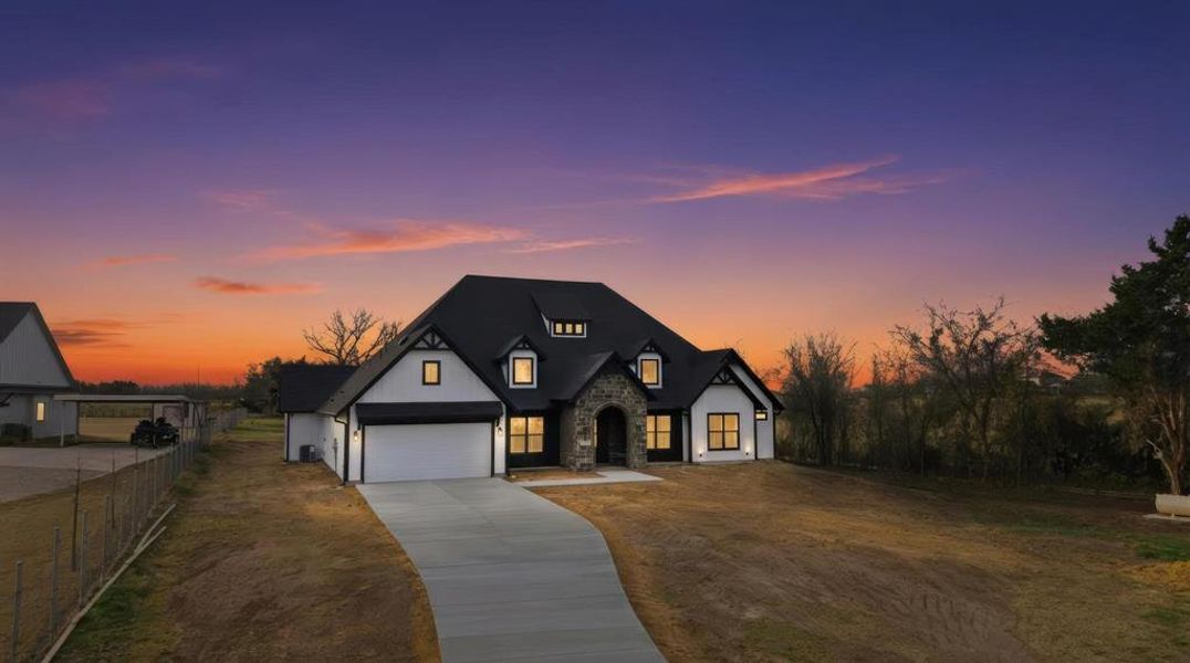 Front exterior of a new home in , Ennis, TX, highlighting curb appeal (Image 20).