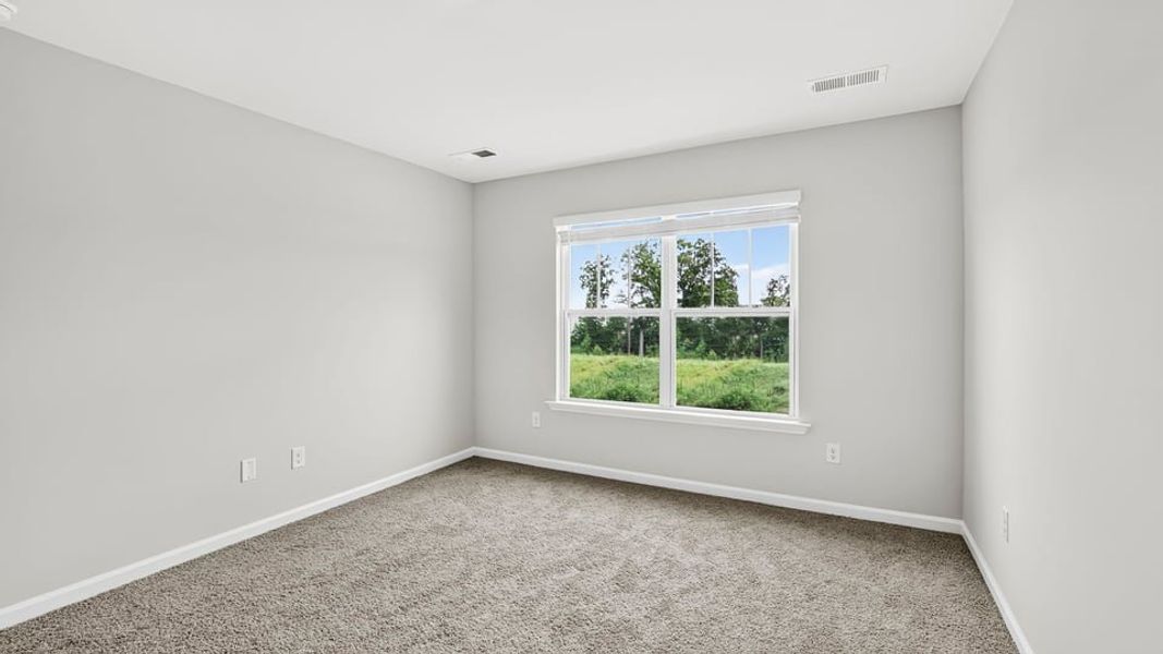 Spacious, unfurnished interior of a new home in Tanglewood Townes, Greenville (Image 31).