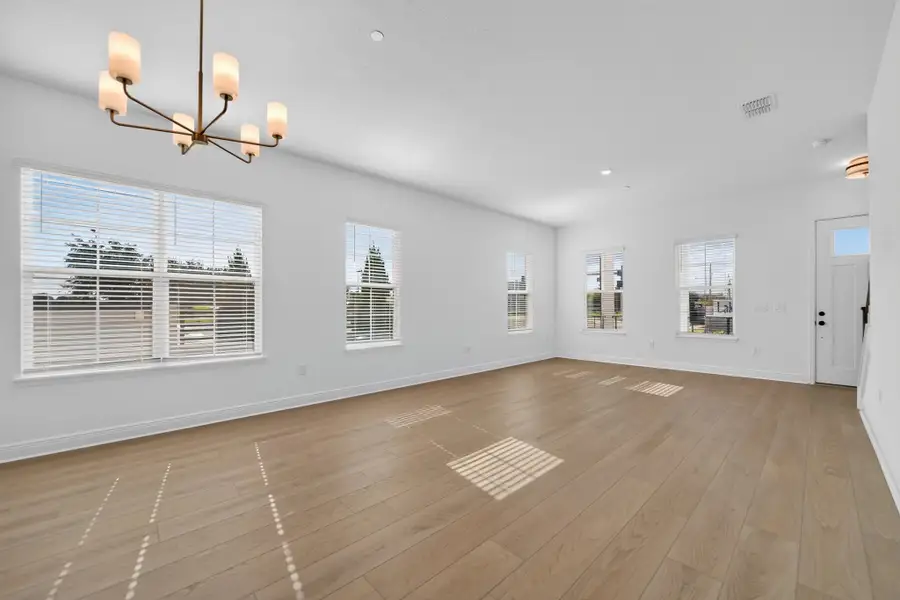 Spacious, unfurnished interior of a new home in Lake Cawood Cove, Windermere (Image 13).