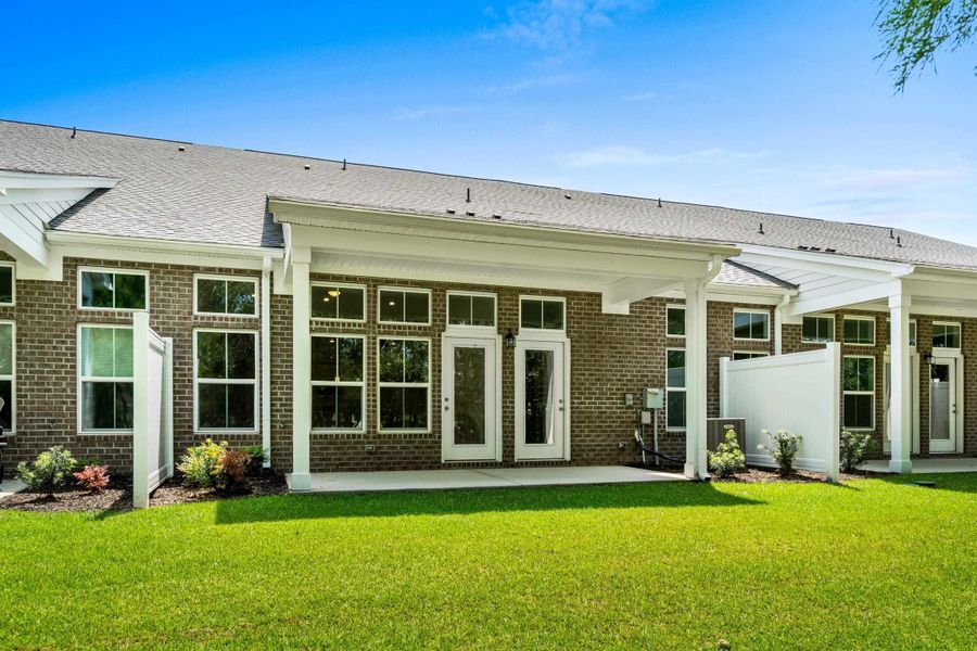 Exterior details and patio area of a home in Long Bay Golf Club, Longs (Image 25).