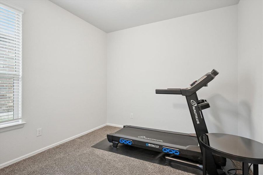 Bedroom currently used as an Exercise room featuring carpet floors. Bedroom currently used as an Exercise room featuring carpet floors.