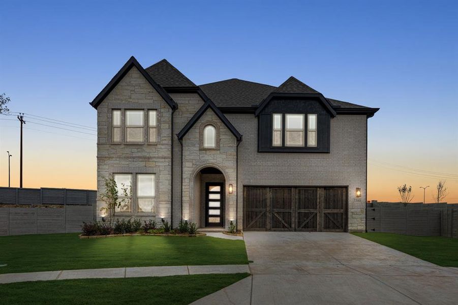 Front exterior of a new home in Painted Tree Woodland District 50, McKinney, TX, highlighting curb appeal (Image 1). Front exterior of a new home in Painted Tree Woodland District 50, McKinney, TX, highlighting curb appeal (Image 1).