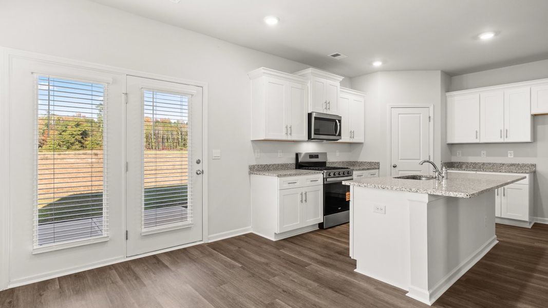 Representative furnished interior of a home built from the Somerset by D.R. Horton in Highland Hills, Graniteville (Image 5).