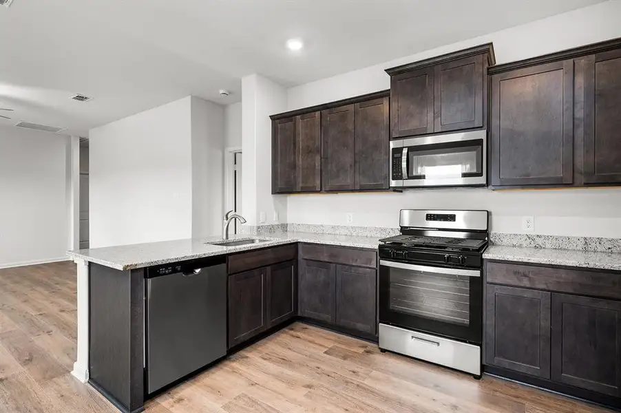 Furnished interior view inside a new home in Big Sky Estates, Ponder (Image 4).