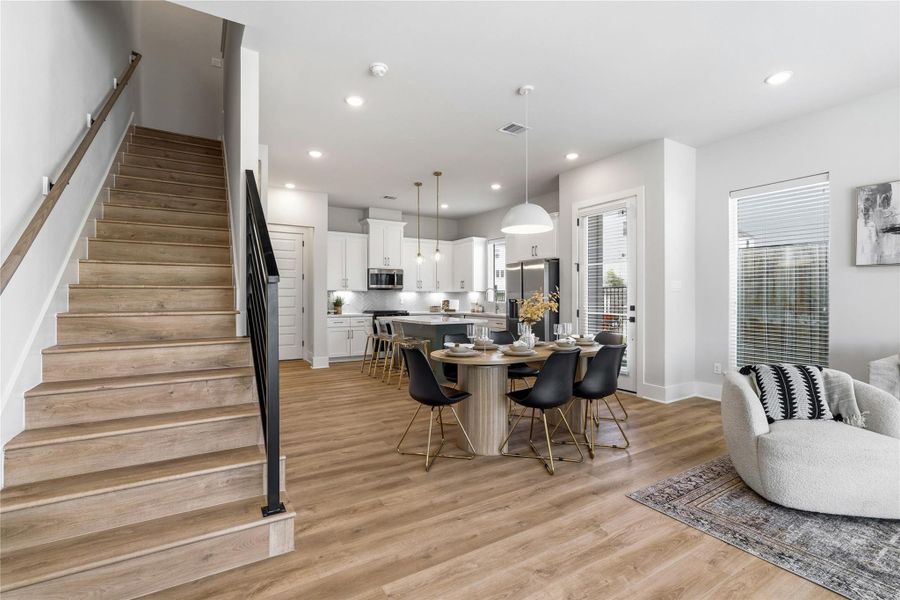 Defined by its open iron railing, the staircase serves as both a functional feature and a subtle architectural statement. Defined by its open iron railing, the staircase serves as both a functional feature and a subtle architectural statement.