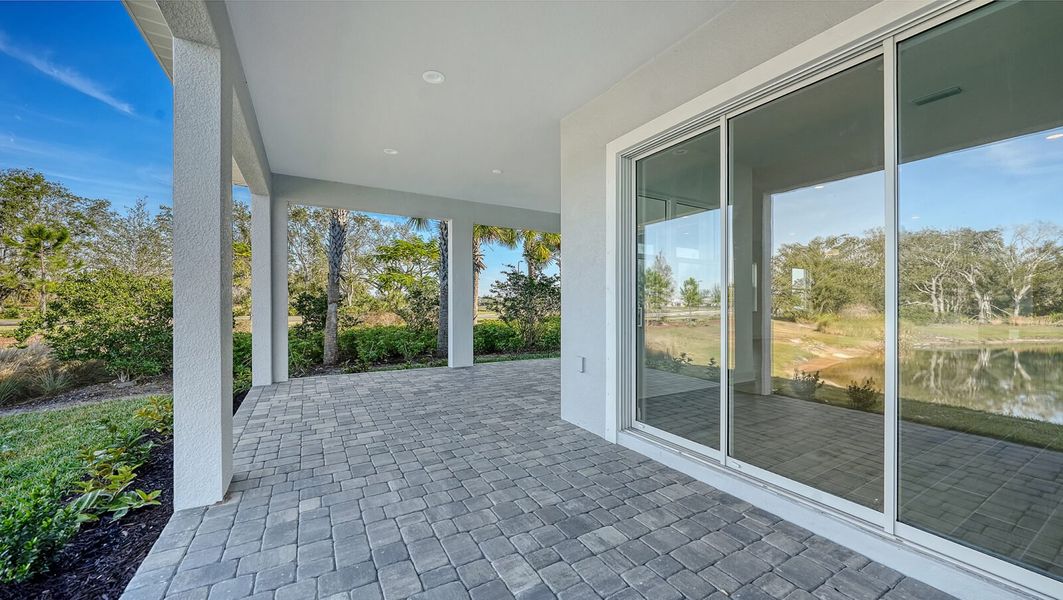 Exterior details and patio area of a home in Wildleaf, Parrish (Image 30).