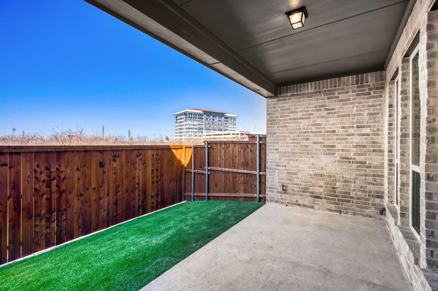Fenced backyard featuring a patio