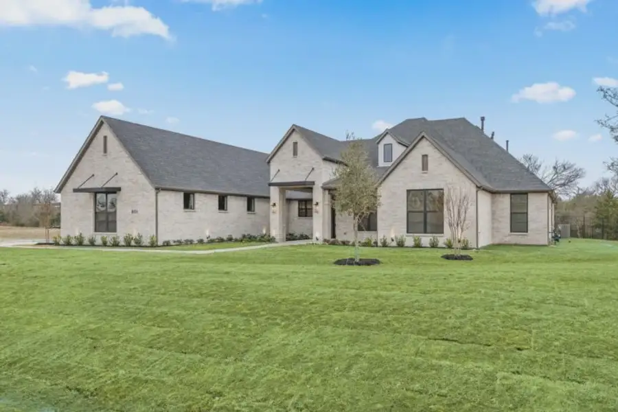 Front exterior of a new home in Harper Estates, Celina, TX, highlighting curb appeal (Image 2).