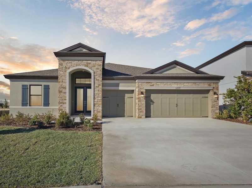 Front exterior of a new home in Caldera, Spring Hill, FL, highlighting curb appeal (Image 2).