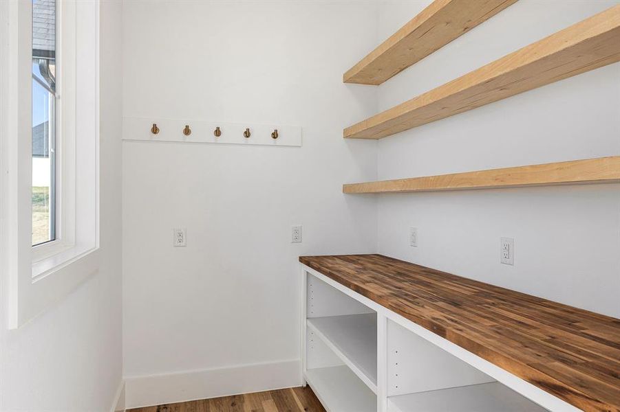 Fantastic pantry with so much storage - and y'all - a window! Who doesn't love a window in a pantry?!