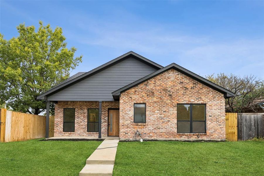 Front exterior of a new home in , Mesquite, TX, highlighting curb appeal (Image 1).