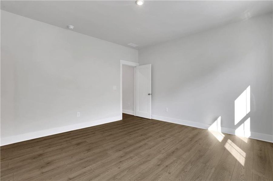 Spacious, unfurnished interior of a new home in The Paddocks at Doc Hughes, Buford (Image 19).