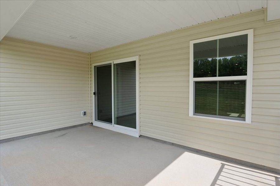 Exterior details and patio area of a home in Wren Woods 2-Story, Gray Court (Image 3).