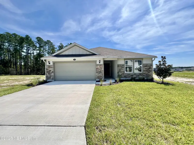 Front exterior of a new home in , Jacksonville, FL, highlighting curb appeal (Image 10). Front exterior of a new home in , Jacksonville, FL, highlighting curb appeal (Image 10).