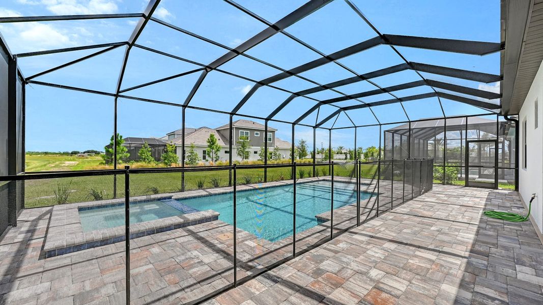 Exterior details and patio area of a home in Palm Grove Real Estate and Homes for Sale in Lakewood Ranch, FL - Neal Communities, Bradenton (Image 2).